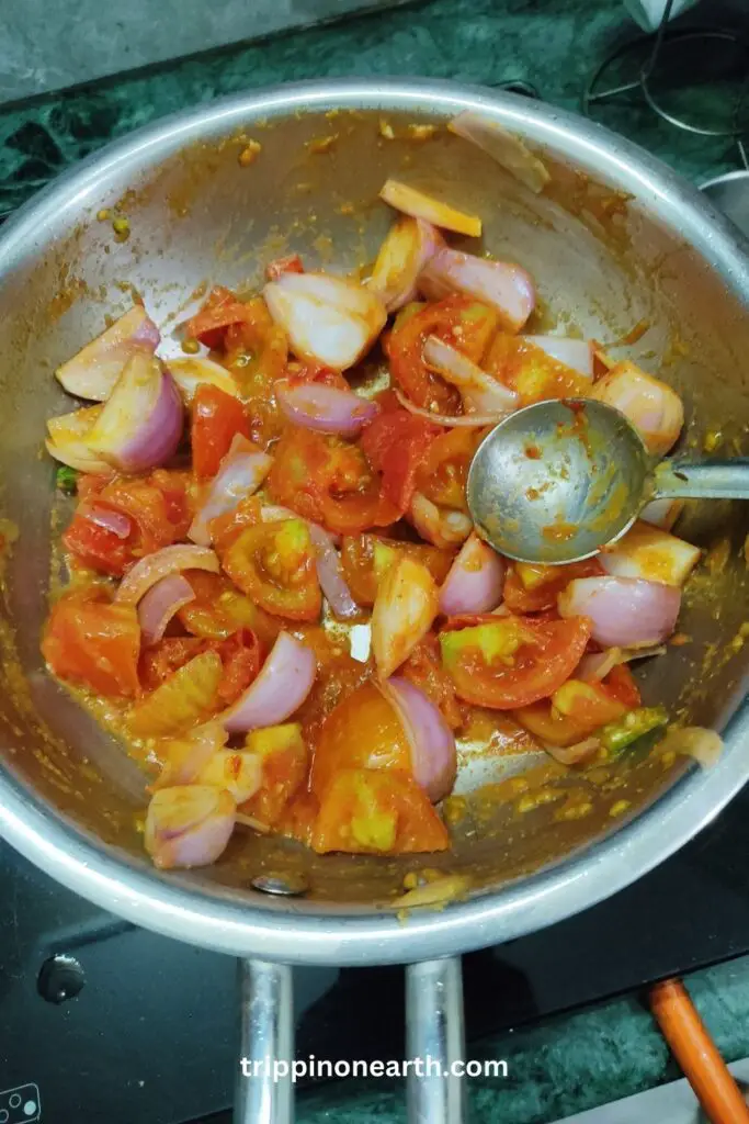 Paneer Tikka Masala, adding spices, onion and tomato for gravy