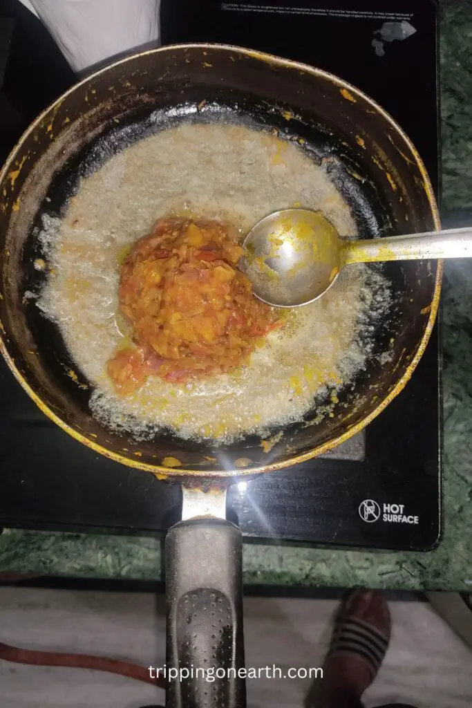 paneer bhurji, add onion and tomatoes