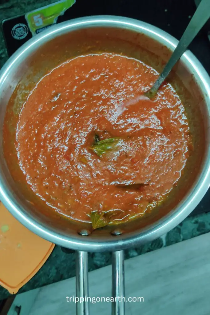 Paneer Butter Masala, tomato puree in the pan