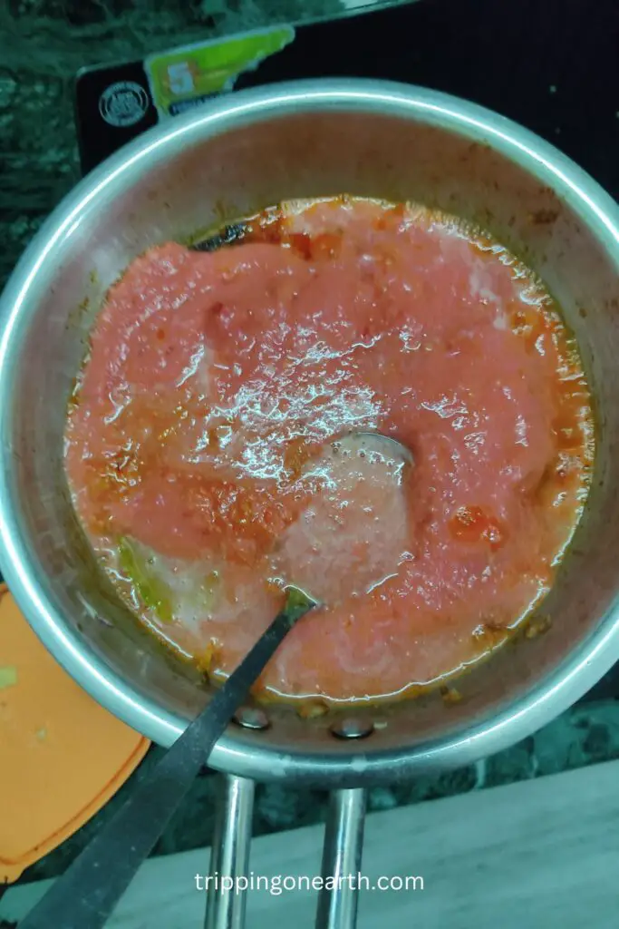 Paneer Butter Masala, add tomato puree