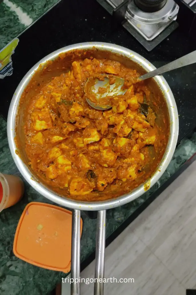 Paneer Butter Masala, mix the paneer and gravy well.