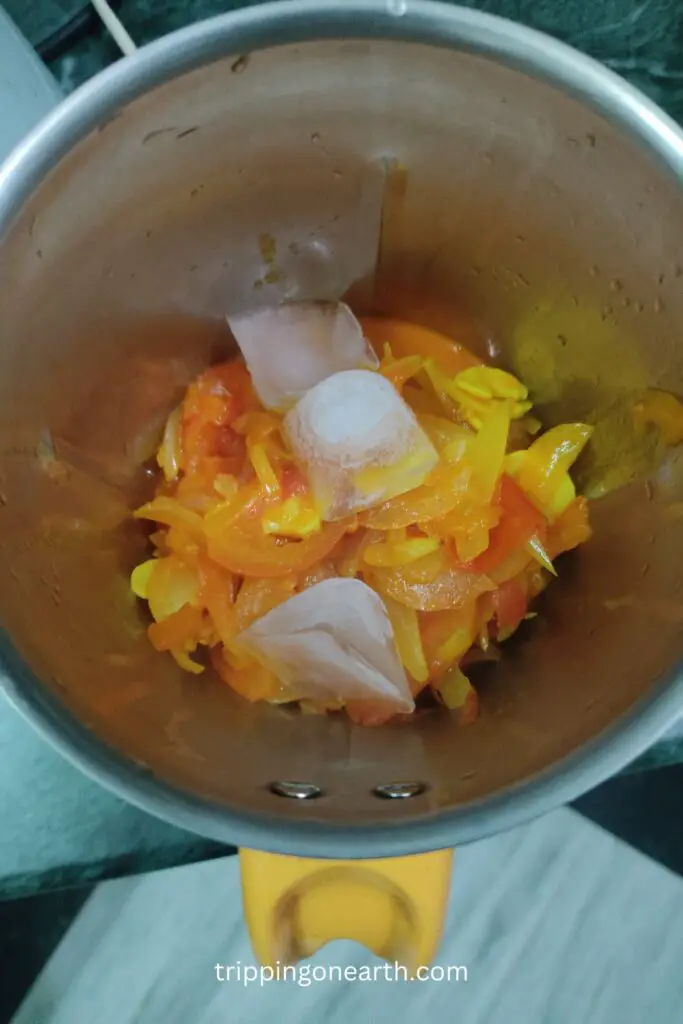 shahi paneer, add onion tomato mixture in grinding jar
