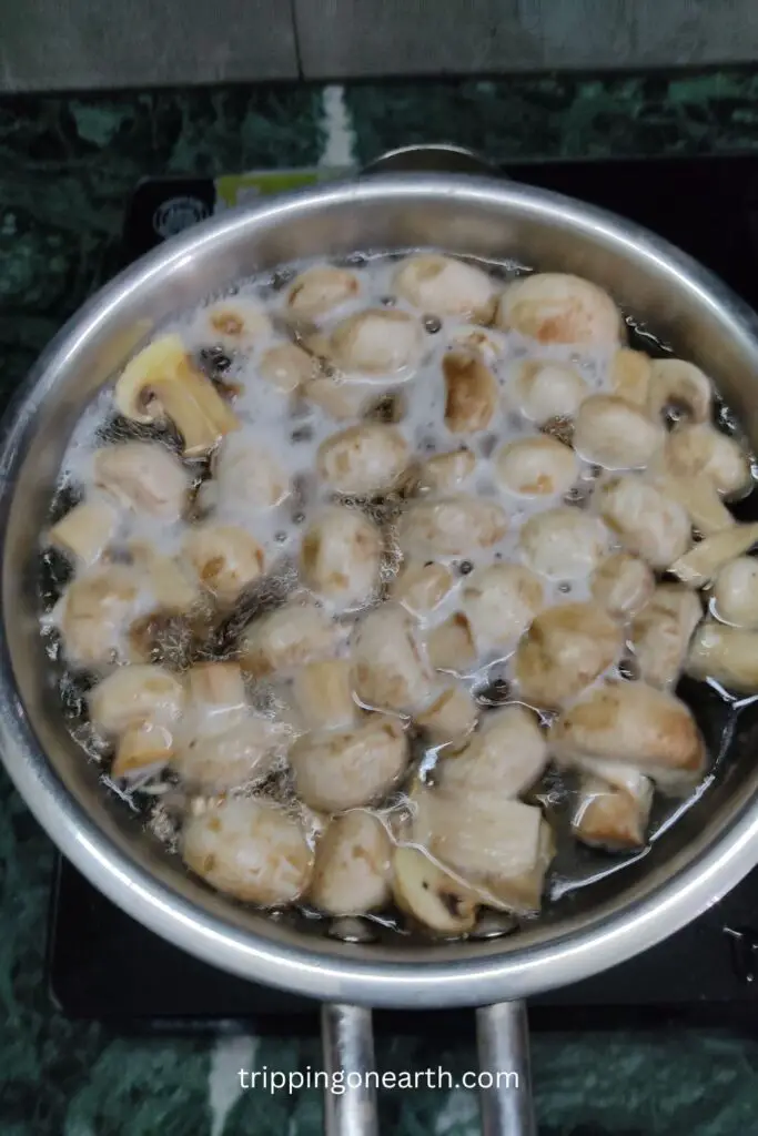 mushrooms boiling in a pan