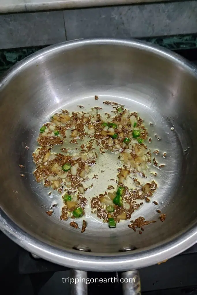 cumin seeds, ginger, garlic, asafetida, green chilies in the pan