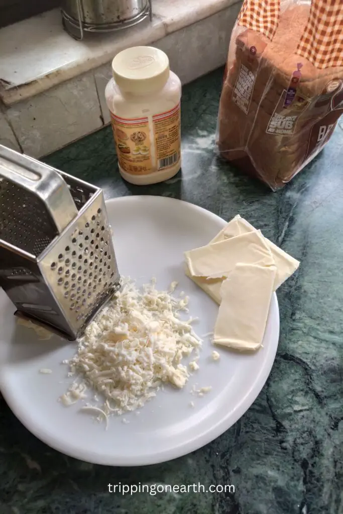 grater, cheese, bread, and mayonnaise