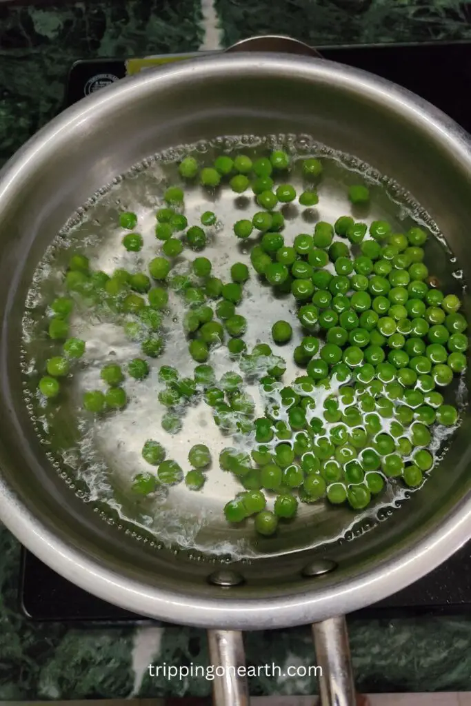 green peas boiling in a pan