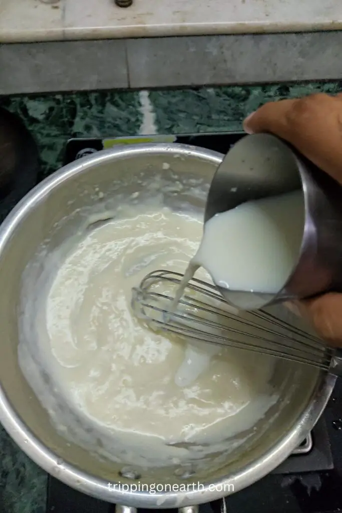 adding milk to the pan