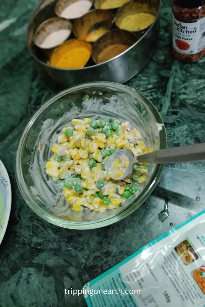 corn peas salad in a glass bowl