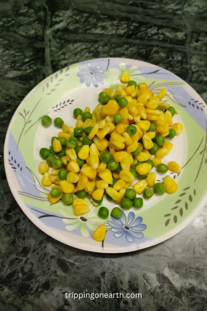 boiled corn and peas on a plate