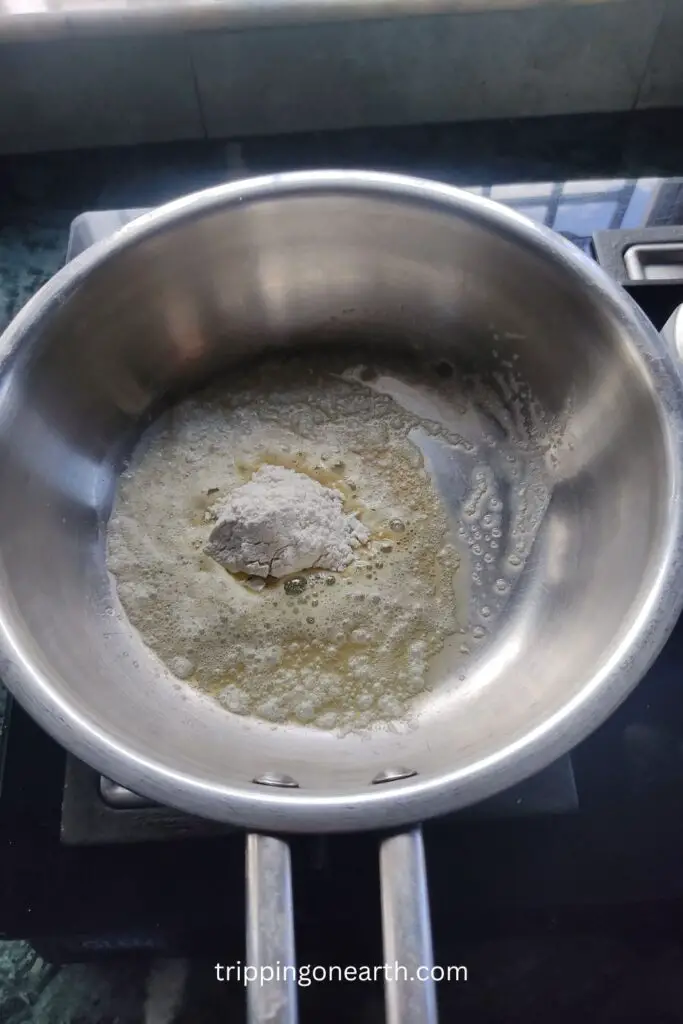 butter, garlic, and refined flour in the pan