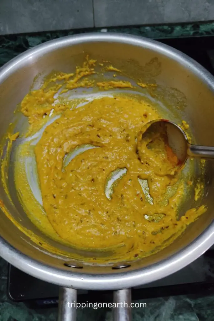 cashew nut paste and powdered spices mixed well in a skillet