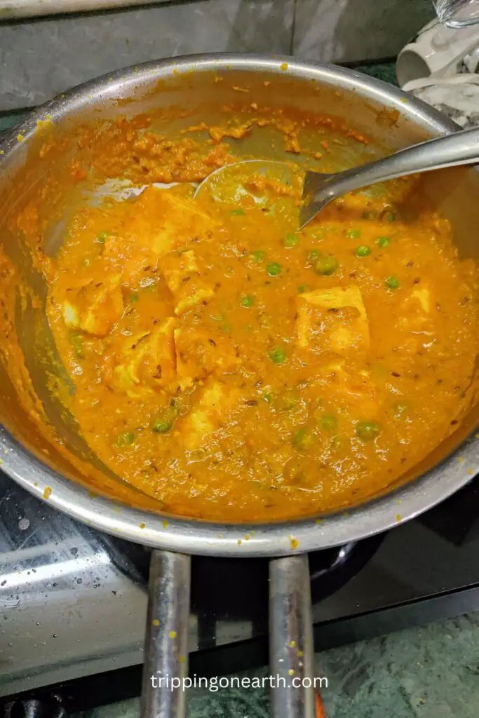matar paneer without onion and garlic in a skillet