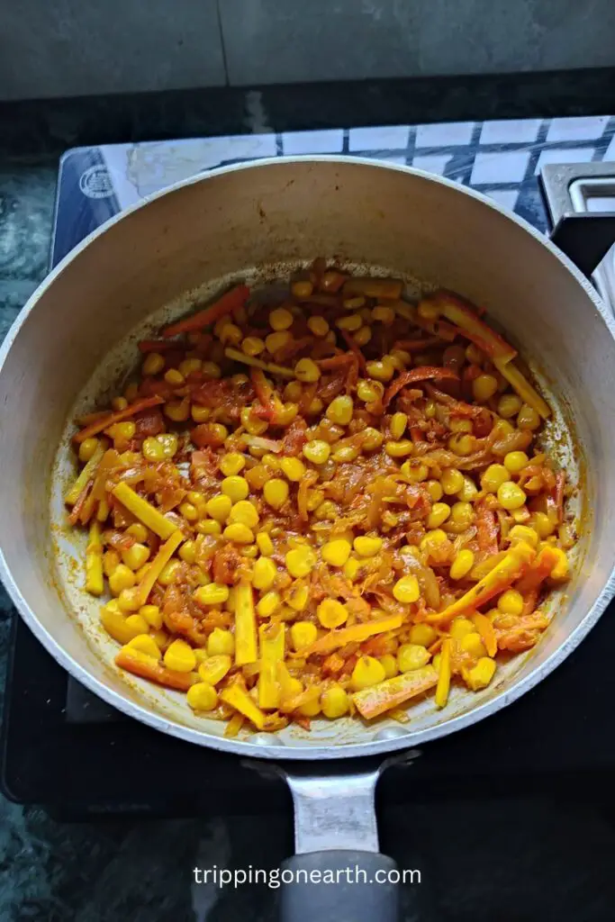 well mixed carrots and sweet corn kernels with tomatoes