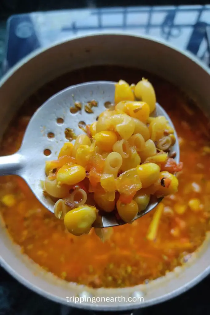 close of macaroni on a ladle
