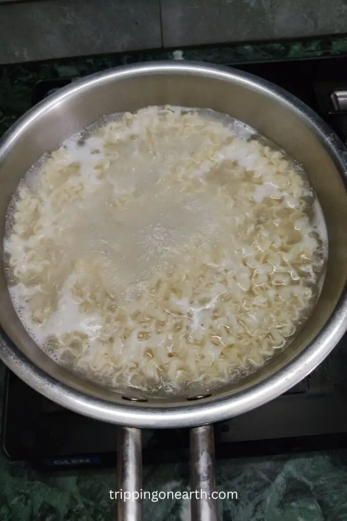 ramen noodles boiling in a pot