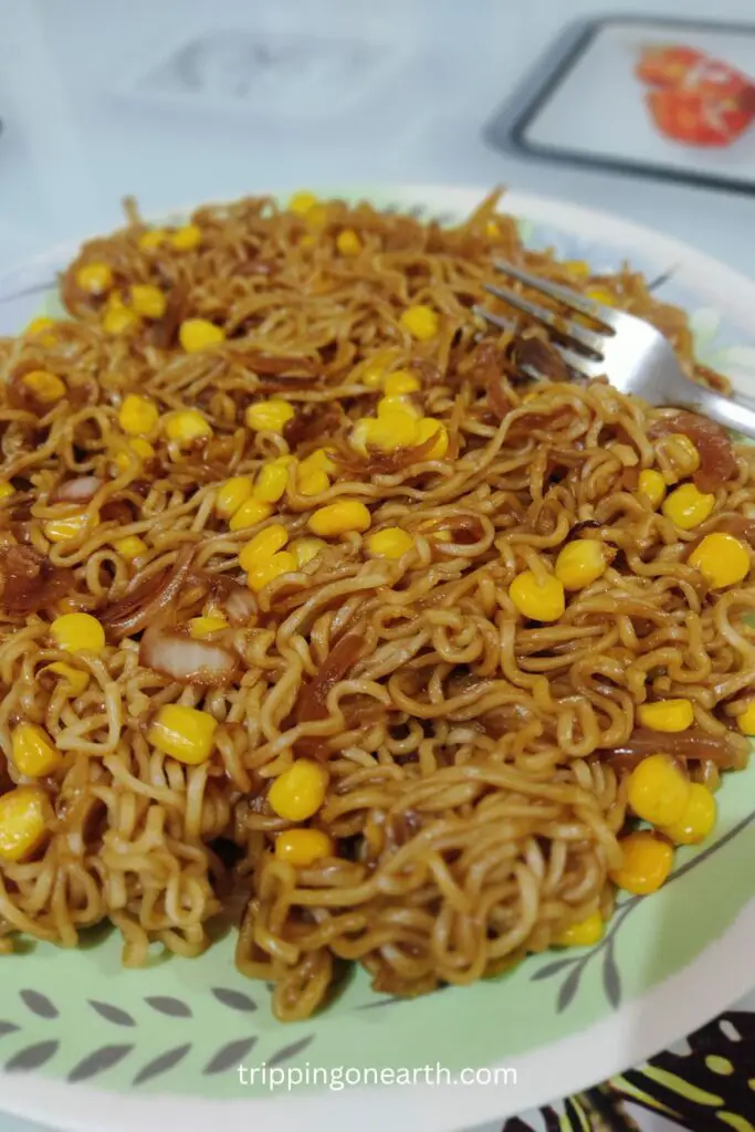 soy butter corn ramen on a plate along with a fork