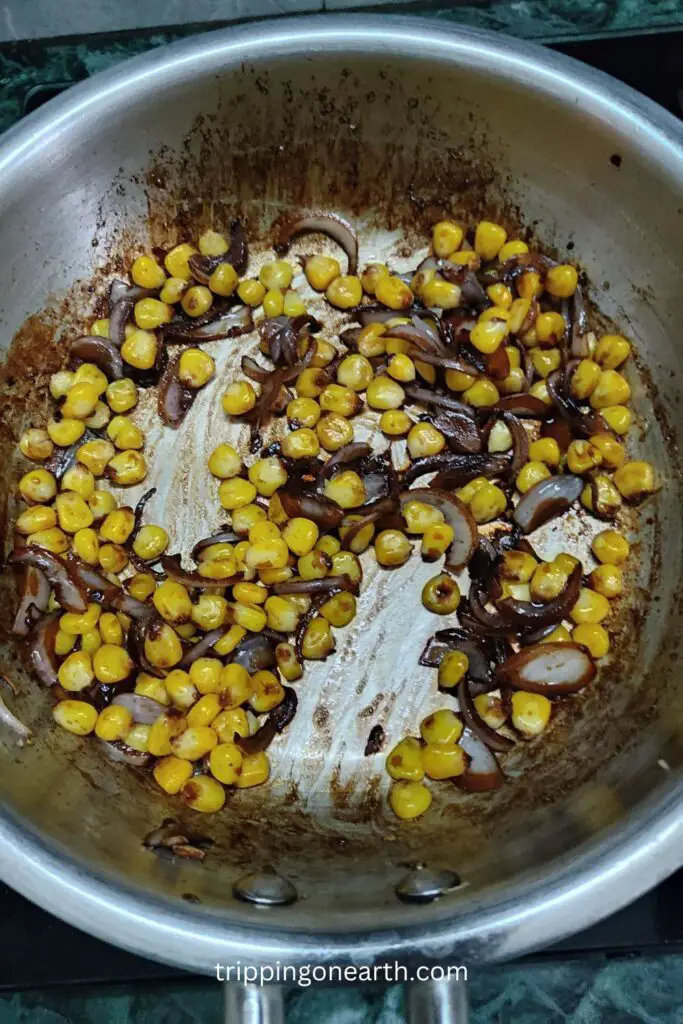corn kernels added in the pan
