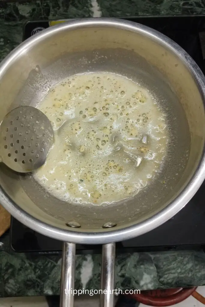 garlic frying in butter in a skillet