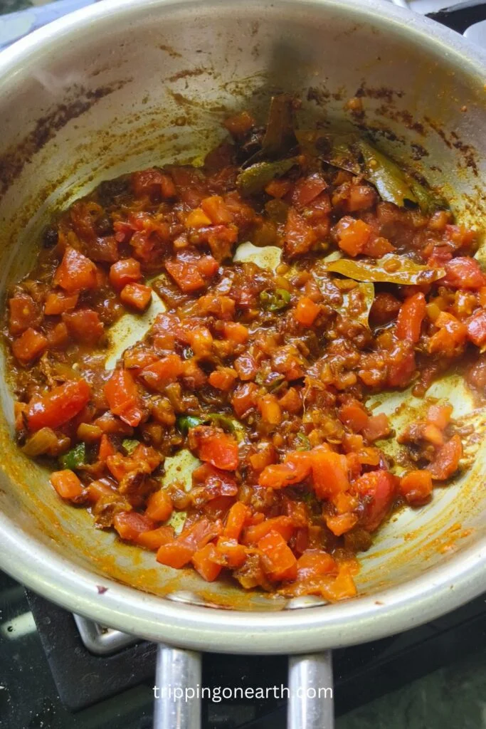 tomatoes in the pan with the onionn mixture