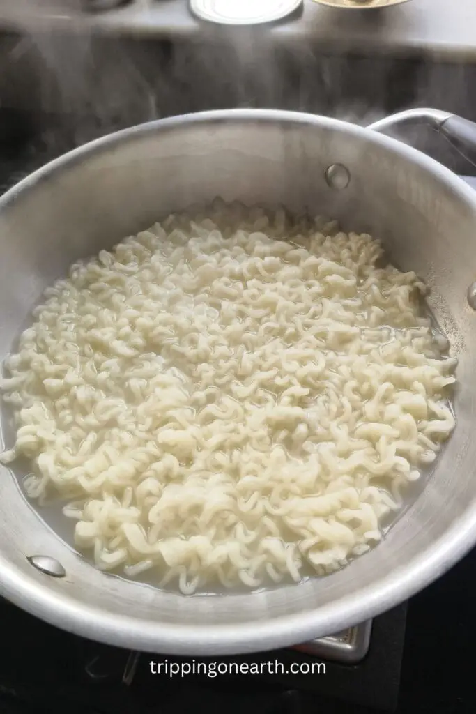 maggi noodles in boiling water in a pot 