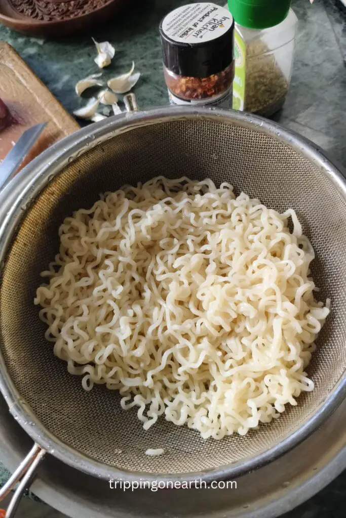 Al dente maggi noodles in a strainer