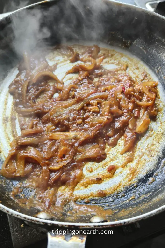 masala mixture of the onion, garlic, oregano, chili flakes with a splash of water