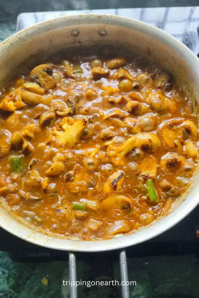 cauliflower and mushroom curry in a skillet