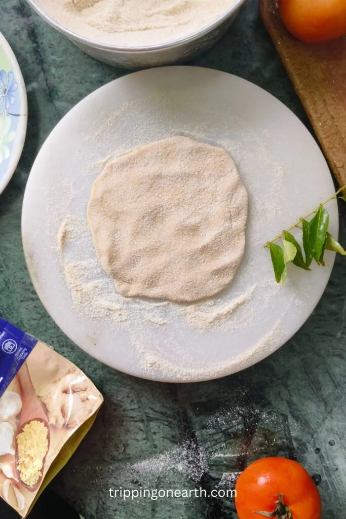 wheat round flat dough on a white marble board