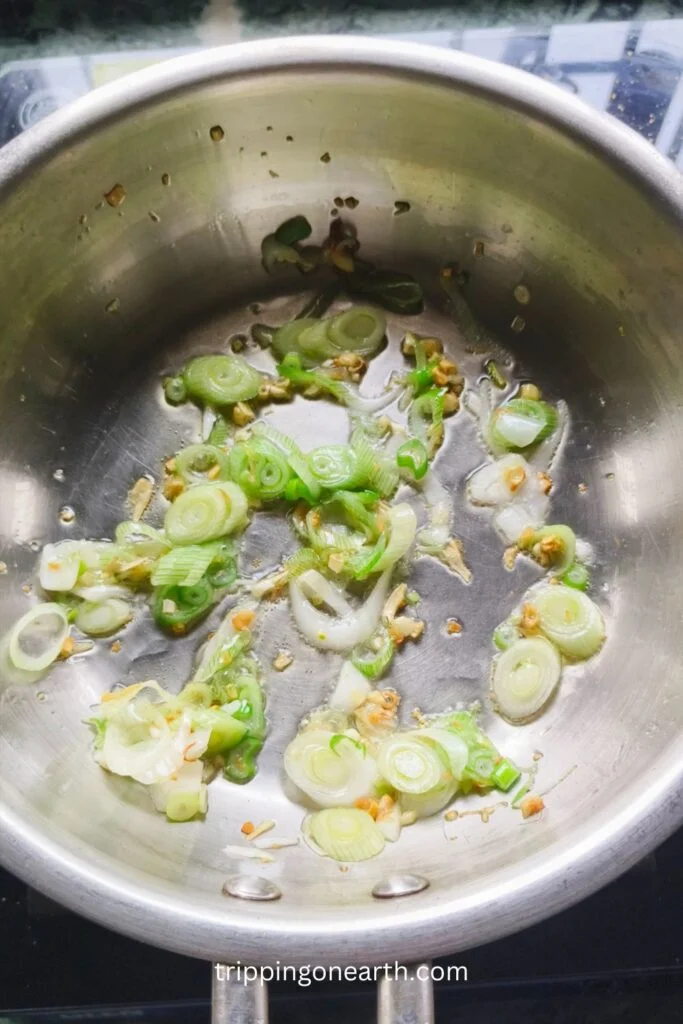 garlic and scallions in a skillet