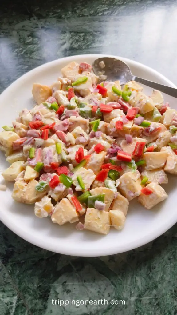 Puerto Rican potato salad on a white plate