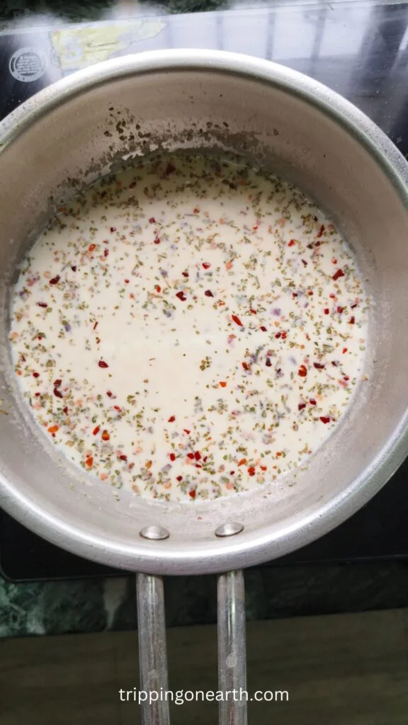 oregano and red chili flakes in the skillet