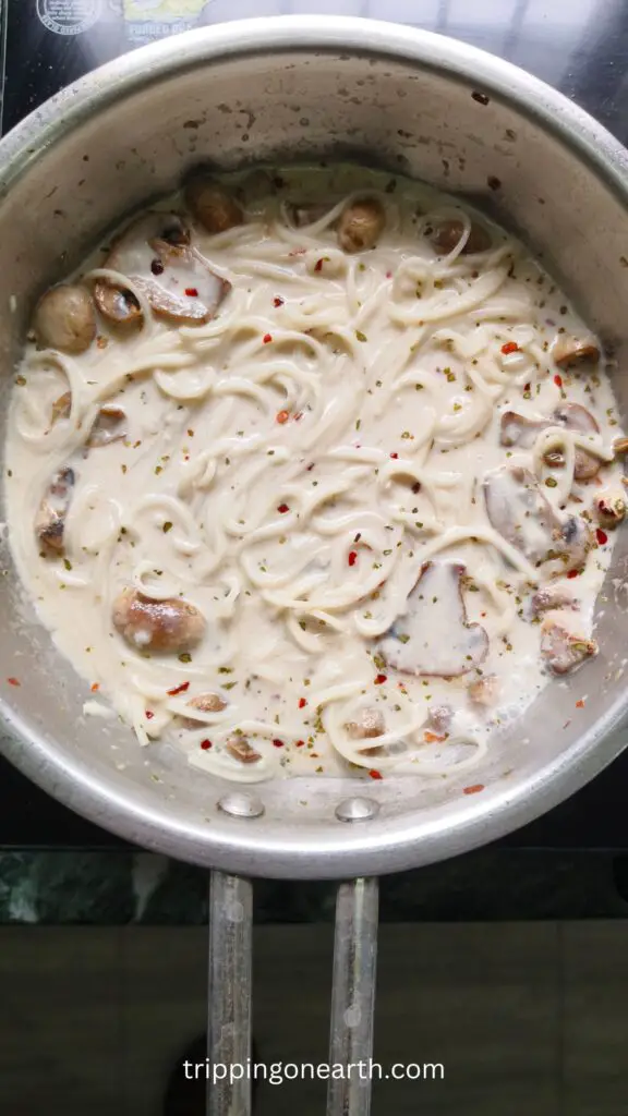 mushroom alfredo pasta in a skillet