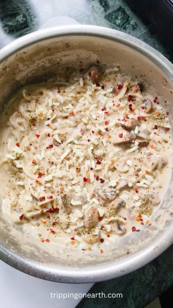 mushroom alfredo pasta in a skillet