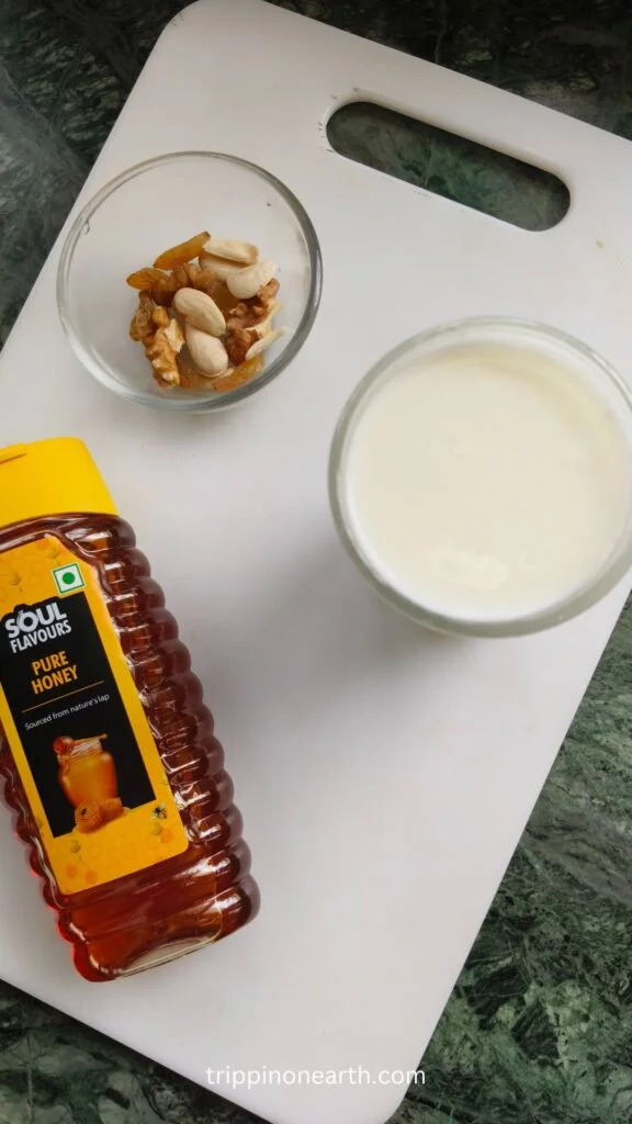 ingredients for dry fruit smoothie: milk, honey, and dry fruits