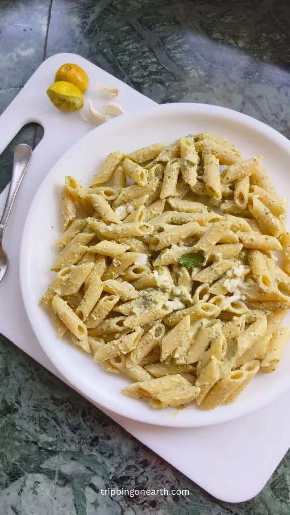 pistachio pesto pasta on a white plate