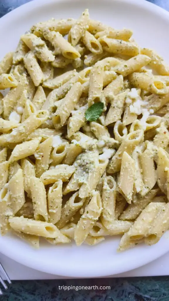 pistachio pesto pasta on a white plate