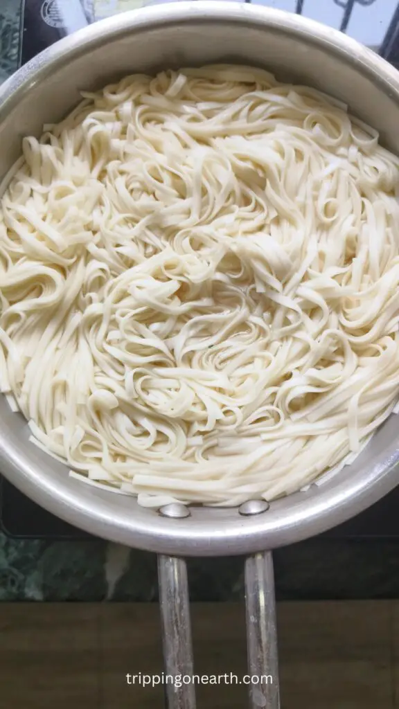 udon noodles al dented in a skillet