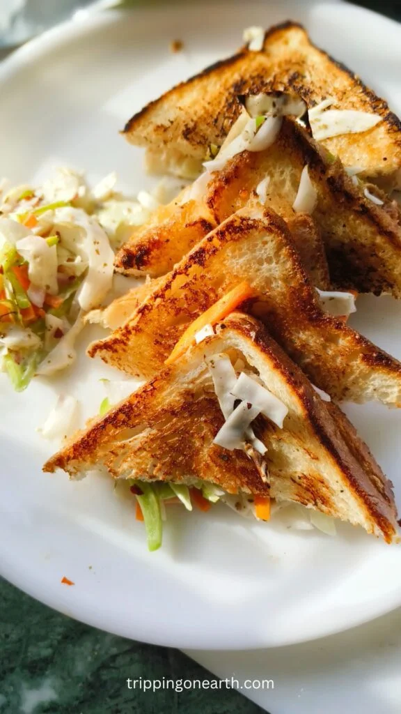 Coleslaw sandwich on a white plate