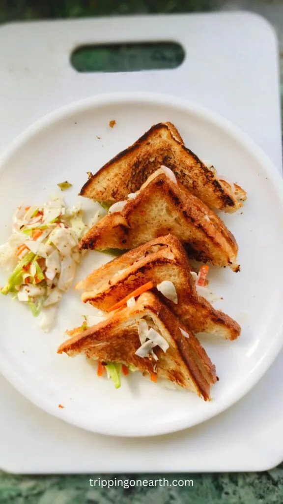 Coleslaw sandwich on a white plate