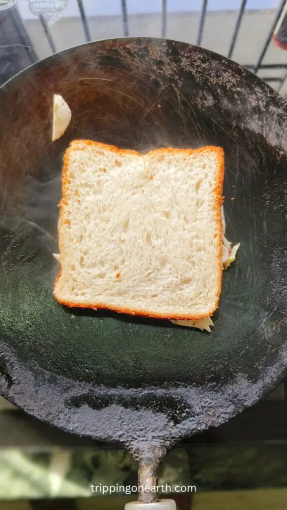 Bread being grilled on a griddle