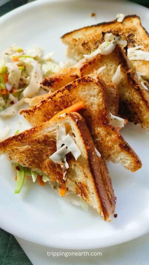 Coleslaw sandwich on a white plate