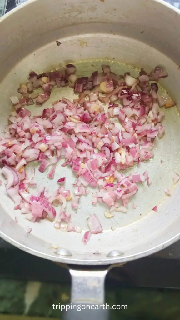chopped onion being cooked in a skillet