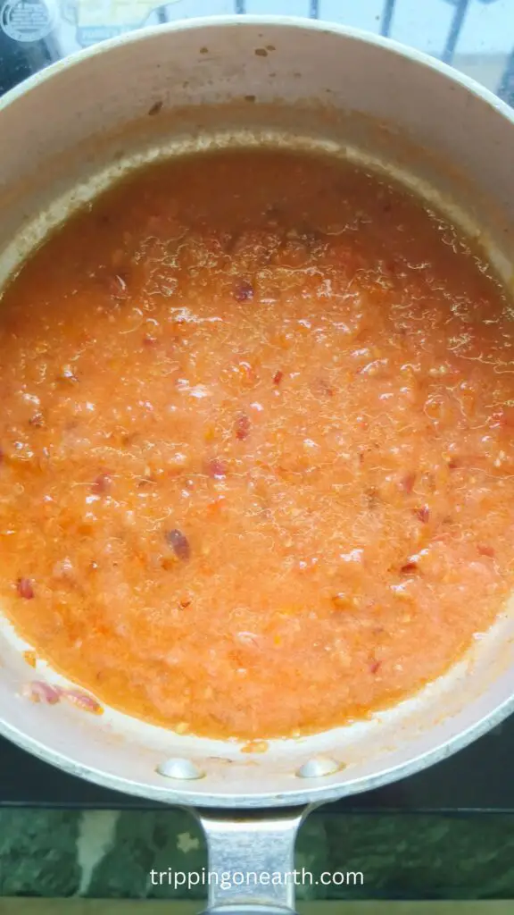tomato puree poured in the skillet