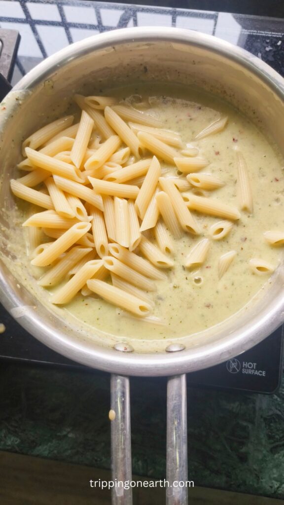 pasta alfredo pesto in a skillet