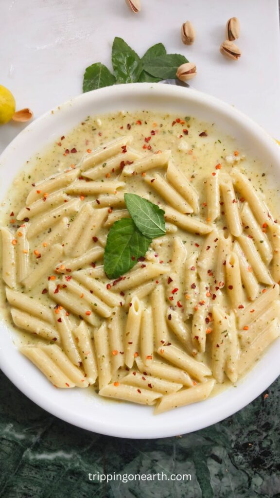 pasta alfredo pesto on a white plate