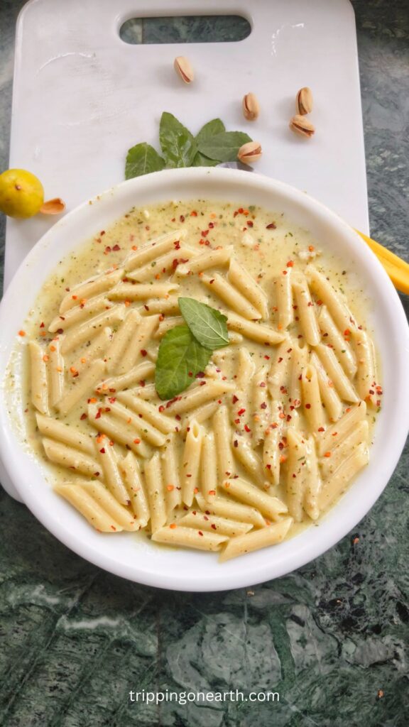 pasta alfredo pesto on a white plate