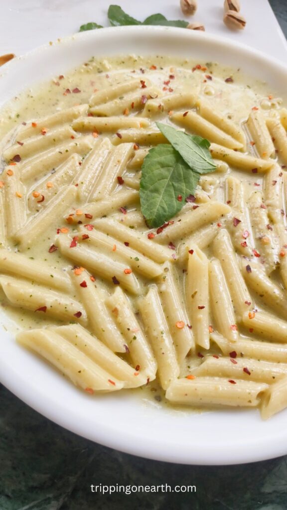 pasta alfredo pesto on a white plate