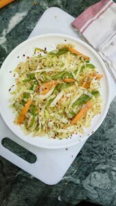 cabbage carrot stir fry on a white plate