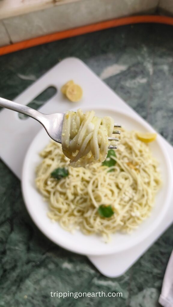 lemon pesto pasta swirled around a fork