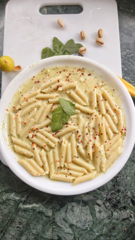 pasta alfredo pesto on a white plate